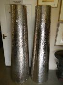A pair of unusual beaten chromed plant stands, 150 cm tall, tops 28 cm diameter.