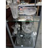 A collection of crystal bowls and vases and other glass bowls