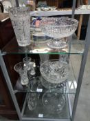 A collection of crystal bowls and vases and other glass bowls