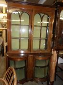 An Edwardian mahogany glazed cabinet with dome front doors to base and string inlay.