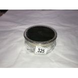 A glass powder pot with silver coloured metal and faux tortoise shell lid number and mark on base