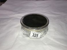 A glass powder pot with silver coloured metal and faux tortoise shell lid number and mark on base