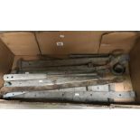 A box of large architectural hinges etc.
