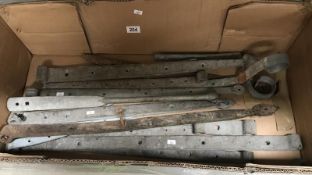 A box of large architectural hinges etc.