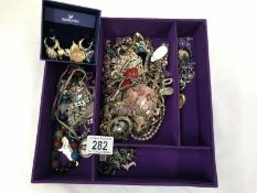 A large box of costume jewellery including Swarovski