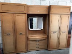 A 3 piece teak effect bedroom wall unit consisting of 2 wardrobes & mirror back chest of drawers