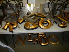 A quantity of large gilded and silvered letters.