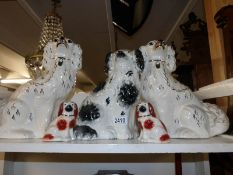 A pair of Staffordshire spaniels, one other and a smaller pair.