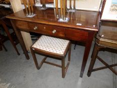 A mahogany side table and a stool.