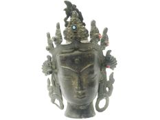 A small bronze Buddha head.