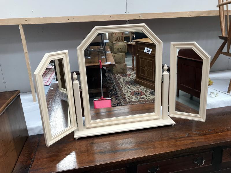 A dressing table mirror