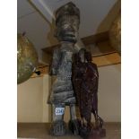 A carved wood figure possibly South American and a carved wood African figure group.