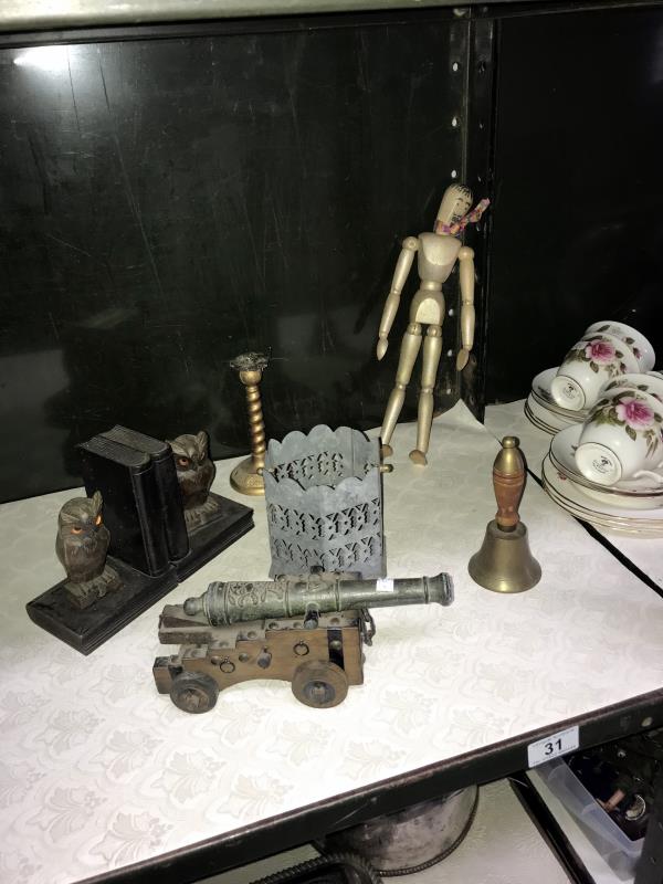 A mixed lot including a pair of owl book ends, miniature cannon etc.