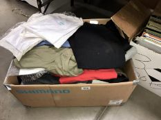A large box of assorted T-Shirts and sports tops etc.