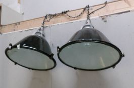 A large pair of metal industrial ceiling lights.