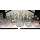 A mixed lot of cut glassware including water jugs, glass basket, bowls etc.
