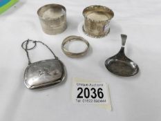 5 items of silver - pill box featuring Manx Triskelion, spoon and 3 napkin rings,