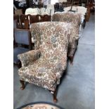 2 fabric covered wing back armchairs