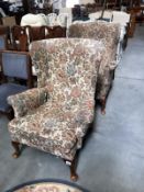 2 fabric covered wing back armchairs