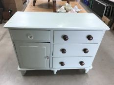 A shabby chic painted pine cupboard