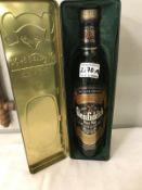 A 1980's bottle of Glenfiddich reserve whisky in clan Maclean tin