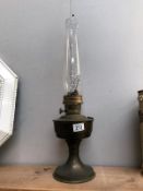 A brass based oil lamp