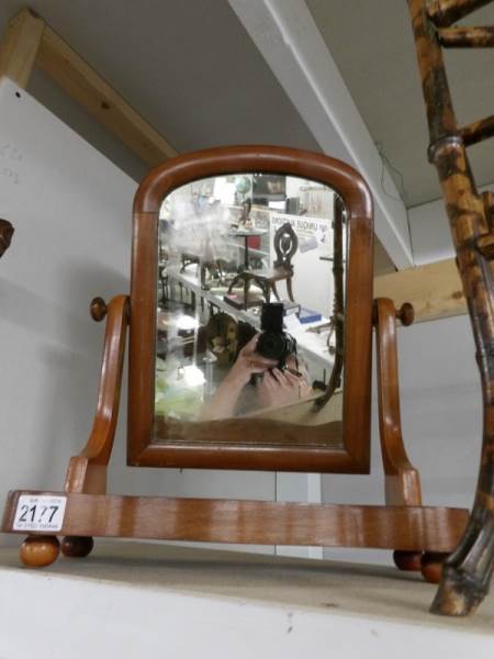 A Victorian mahogany toilet mirror.