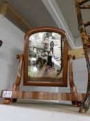 A Victorian mahogany toilet mirror.