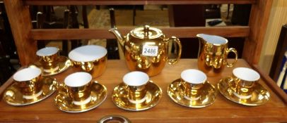 A 15 piece Royal Worcester gold coloured tea set comprising, teapot, sugar bowl, milk jug,