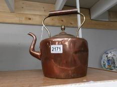 A Victorian copper kettle (dented).