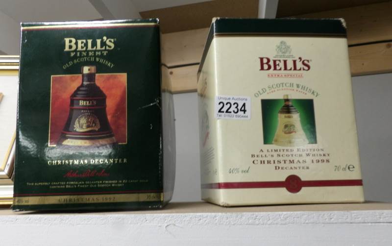 2 boxed Bell's Christmas whisky bells with contents.
