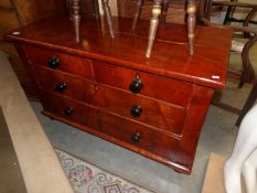 A mahogany 2 over 2 chest of drawers.