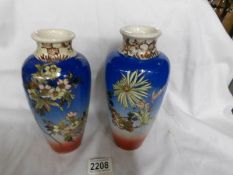 A pair of Chinese floral decorated vases.