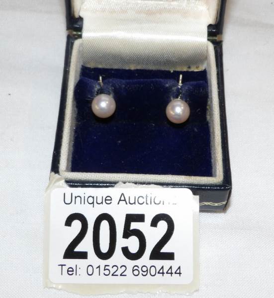 A pair of cultured pearl ear studs.