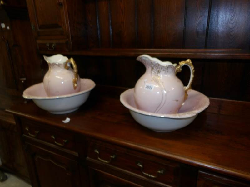 A pair of jug and basin sets, a/f.