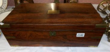 A Victorian mahogany writing slope with drawer and key.