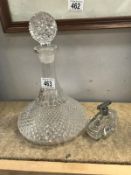 An etched glass decanter and perfume bottle
