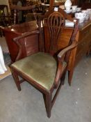 A late 19th / early 20th century mahogany elbow chair.