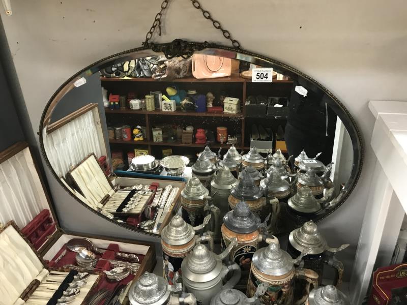 A 1930's metal frame bevel edge mirror