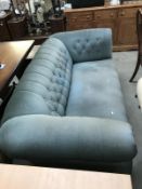 A deep buttoned Draylon covered Chesterfield sofa/settee