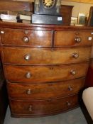 A Victorian mahogany 2 over 4 bow front chest of drawers.
