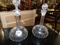 A pair of Victorian glass decanters (odd stoppers).