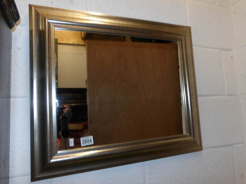 A framed mirror.
