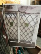 A framed leaded window with stained glass panes - Approximately 39 1/4 x 47 3/4" A/F