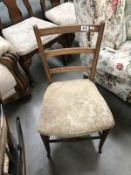 An Edwardian oak hall chair