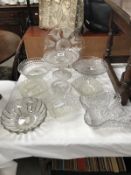 A quantity of vintage moulded glass dishes, cake stands etc.