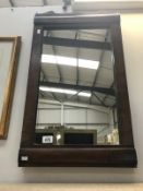 An Edwardian mirror in mahogany frame