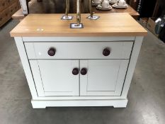 A shabby chic painted kitchen cupboard