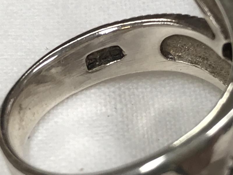 A silver ring stamped 925