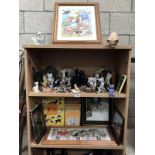 3 shelves of cat ornaments including books and pictures